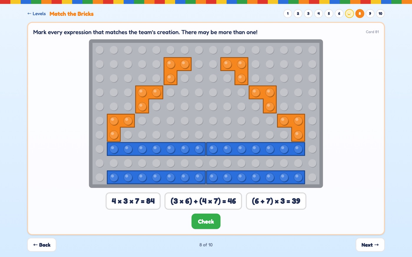 An arch of six orange L-shaped bricks above four blue 7-stud bricks
