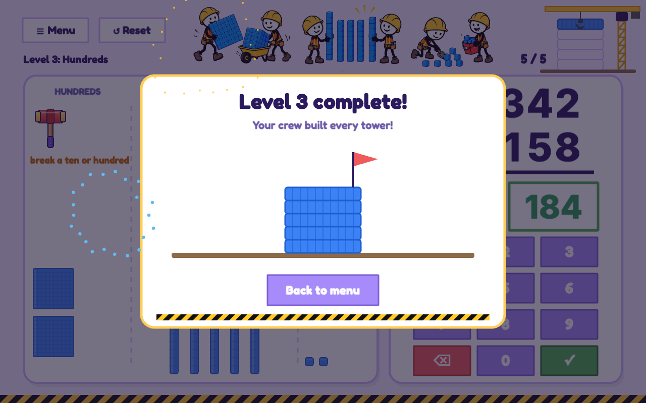 Level complete: the finished tower with a flag on top and fireworks